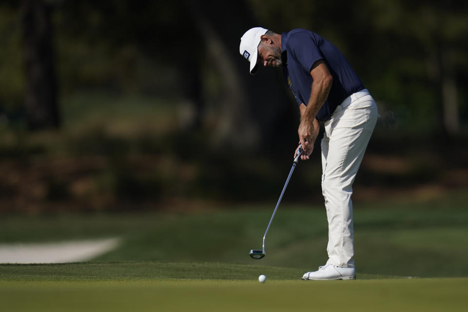 Lee Westwood, of England, putts on the 11th hole during the final round of The Players Championship golf tournament Sunday, March 14, 2021, in Ponte Vedra Beach, Fla. (AP Photo/Gerald Herbert)