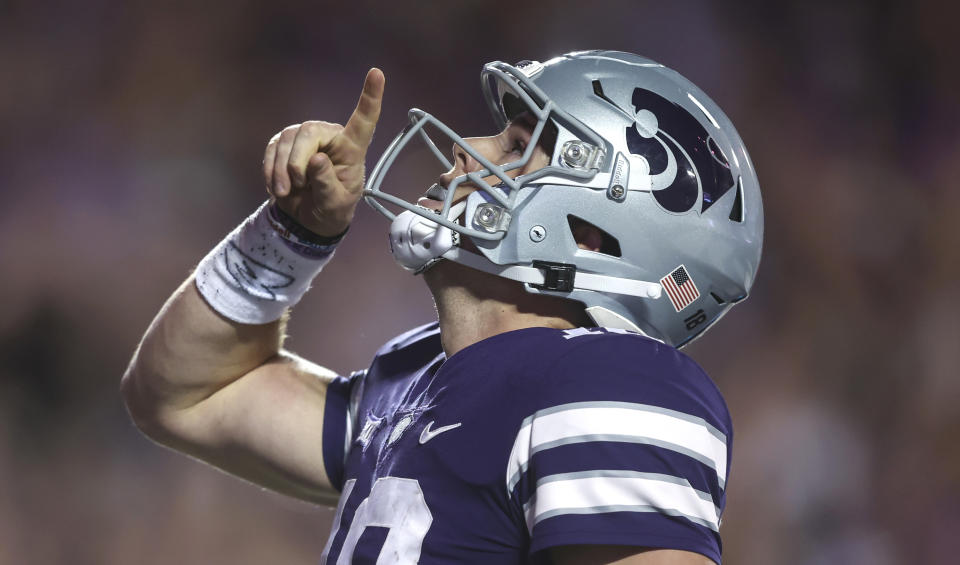 Kansas State quarterback Will Howard celebrates a touchdown during the third quarter of an NCAA college football game against Central Florida on Saturday, Sept. 23, 2023, in Manhattan, Kan. (AP Photo/Travis Heying)