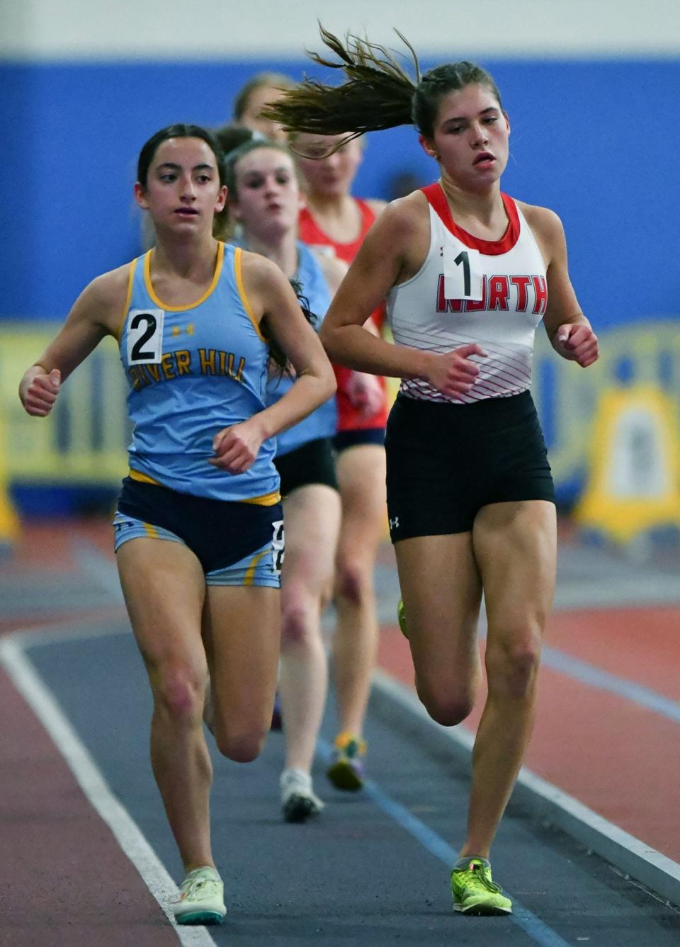 North Hagerstown's Lauren Stine, right, and River Hill's Lauren Virmani race side by side in the Class 3A girls 3,200-meter run during the Maryland Indoor Track and Field Championships.  Stine finished second to Virmani.