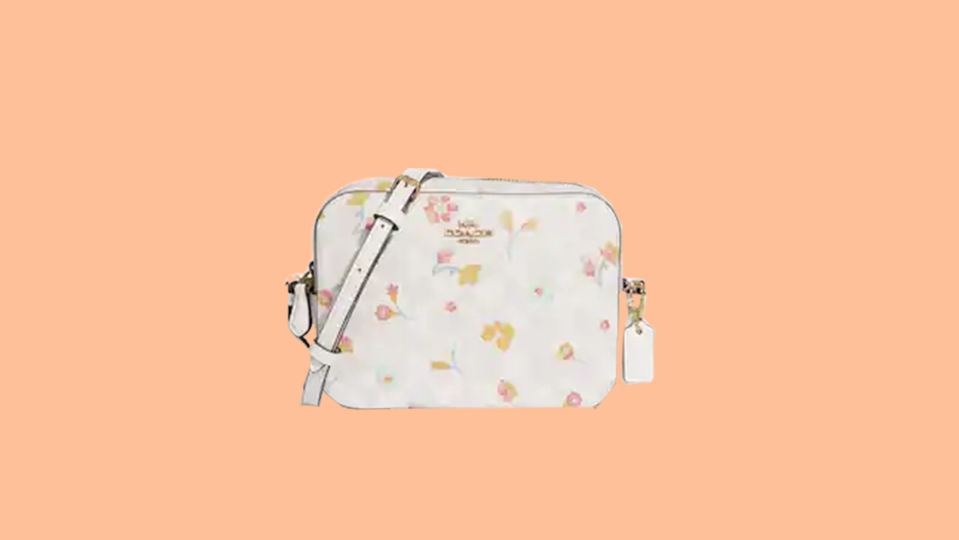 Enjoy a price cut of $180.70 on this trendy floral Coach camera bag at Coach Outlet.