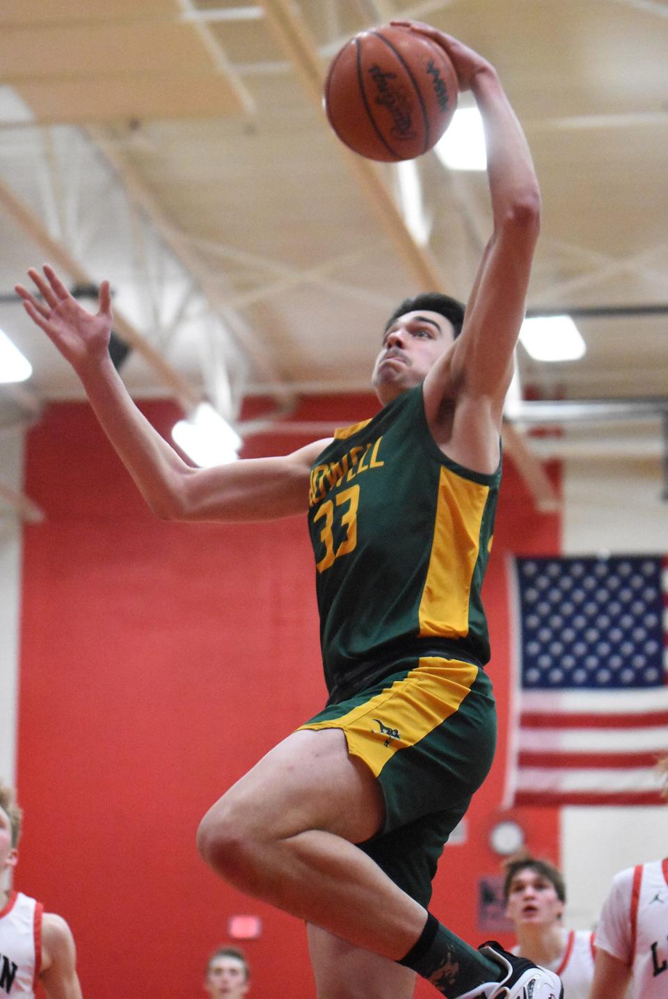 Howell's TJ Fischhaber goes up for a dunk during a 69-38 victory over Linden in a first-round Division 1 district basketball game Monday, March 6, 2023.