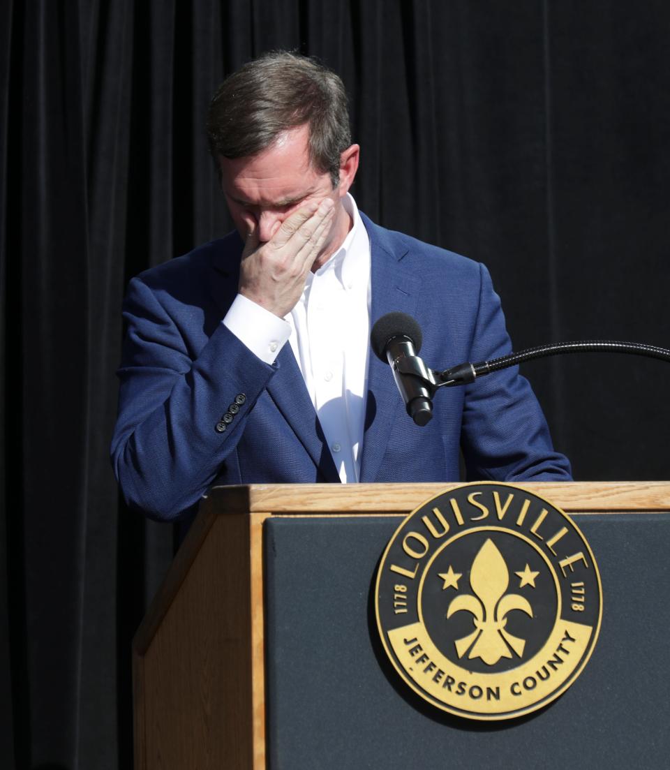Gov. Andy Beshear became emotional as he talked about the friends he lost in a mass shooting at the Old National Bank during a community vigil at the Ali Center to honor the victims in Louisville, Ky. on Apr. 12, 2023.  