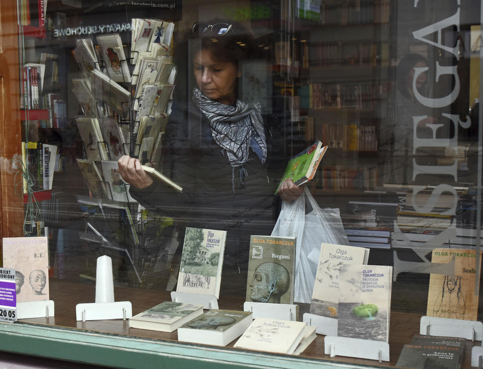 Books written by Olga Tokarczuk are on display in the bookshop of Tokarczuk's publisher Wydawnictwo Lliterackie in Krakow, Poland, Thursday, Oct. 10, 2019. Polish author Olga Tokarczuk and Austrian author Peter Handke won the 2018 and 2019 Nobel Prizes for literature. Two Nobel Prizes in literature were announced Thursday after the 2018 literature award was postponed following sex abuse allegations that rocked the Swedish Academy at that time. (AP Photo/Marek Lasyk)