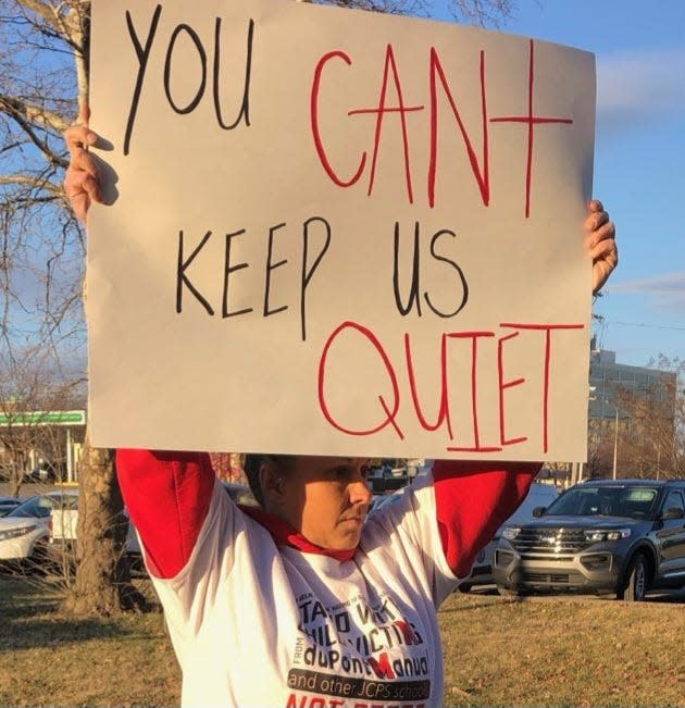 Jessica Vineyard protests outside the Jefferson County Public Schools central office in Louisville on Tuesday, calling for the firing of former dupont Manual High School football coach Donnie Stoner and his brother Ronnie. Feb. 13, 2024