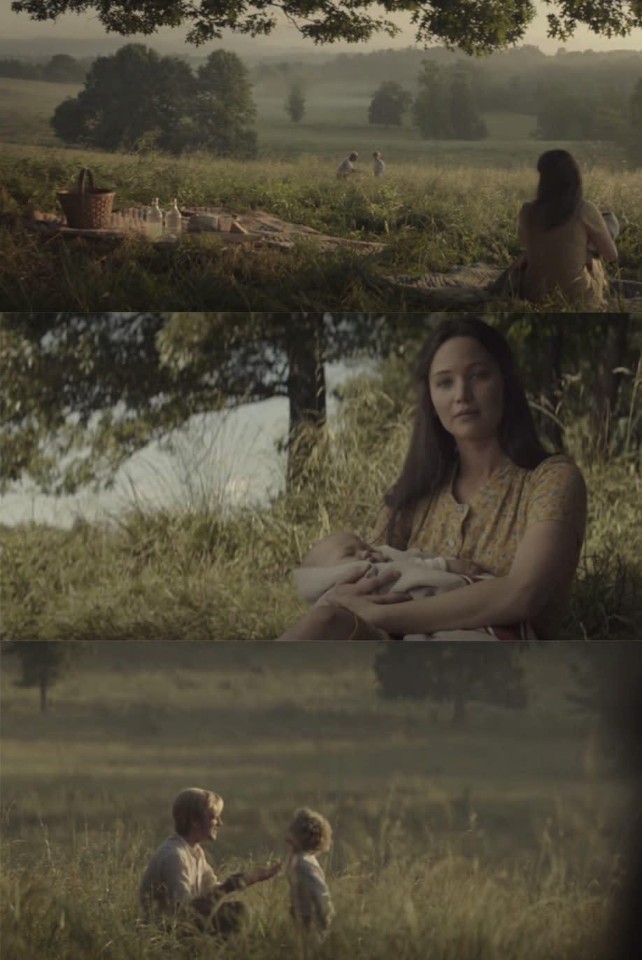 Katniss sits at a picnic with Peeta and their kids.