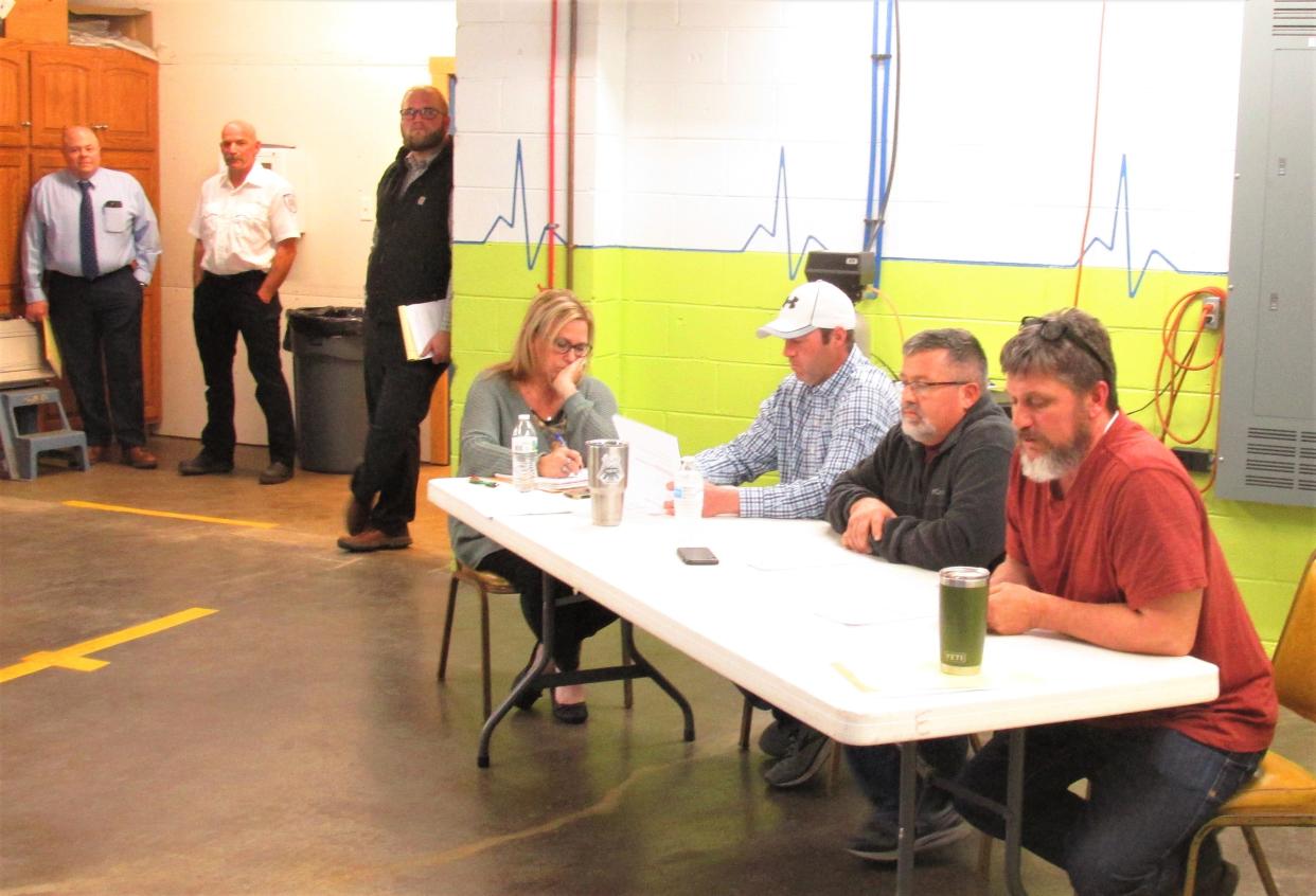 Attorney Porter 'Chip' Welch (from left), Reuben Miller, Holmes County Prosecutor Matt Muzic, Prairie Township financial officer Carol Snyder, and trustees Matt Steiner and Paul Troyer look on as Trustee Stacey Shaw announces the resignation of Miller as chief of the Prairie Township Fire Department at Tuesday's public meeting. Shaw said Miller will serve as interim assistant chief.