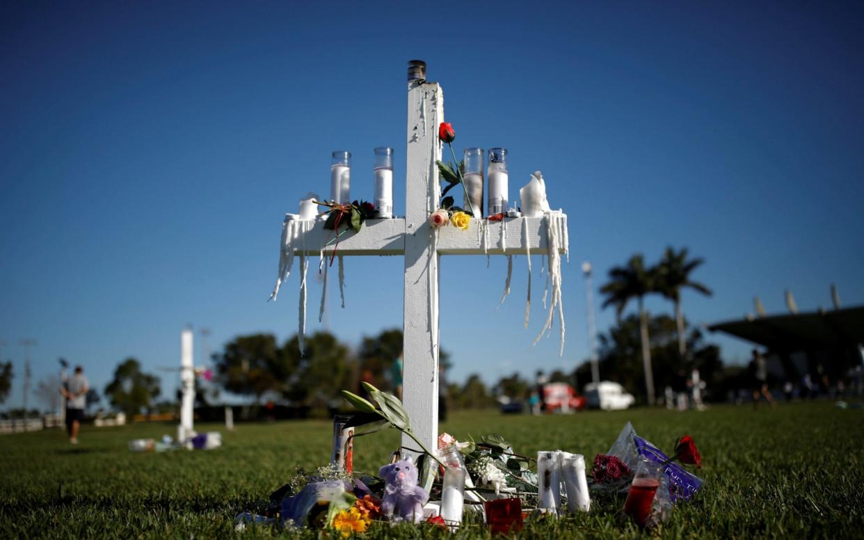 Crosses are seen in a park to commemorate the victims of the shooting at Marjory Stoneman Douglas High School, in Parkland - REUTERS