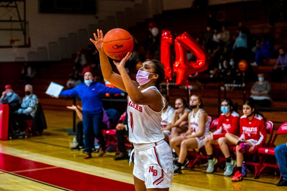 New Bedford's Vanessa Bucha attempts the three pointer.