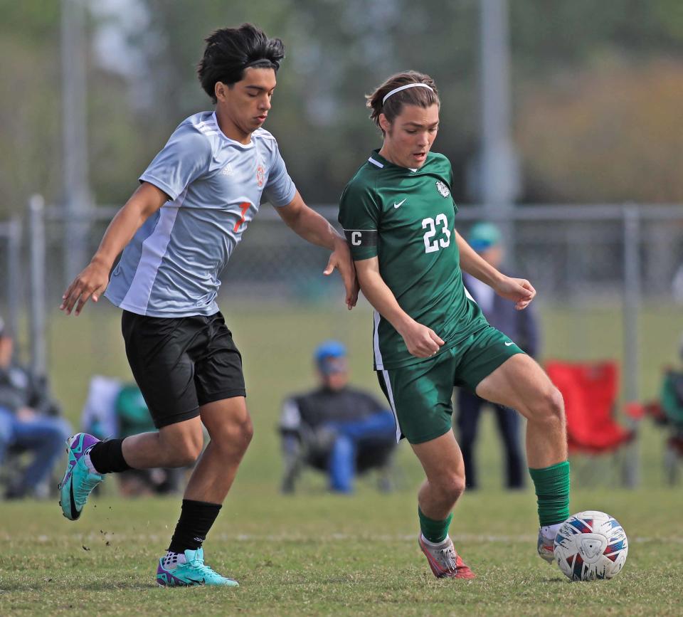 Flagler Palm Coast's Aron Binkley (23) defends the ball during the Five Star Conference boys and girls soccer quarterfinals at Ormond Beach Sports Complex on Saturday, Jan.13th, 2024.