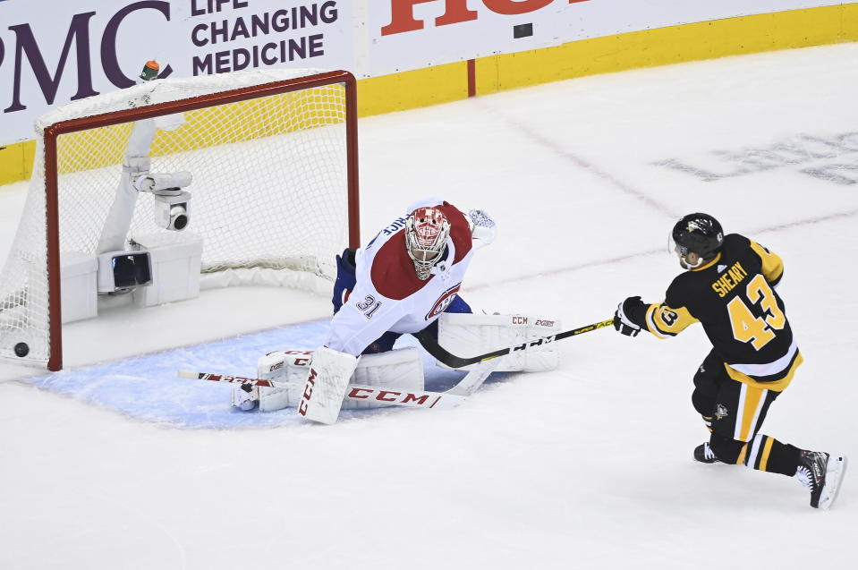 Pittsburgh Penguins left wing Conor Sheary (43) gets stopped on a penalty shot by Montreal Canadiens goaltender Carey Price (31) during the third period of an NHL hockey playoff game in Toronto, Saturday, Aug. 1, 2020. (Nathan Denette/The Canadian Press via AP)