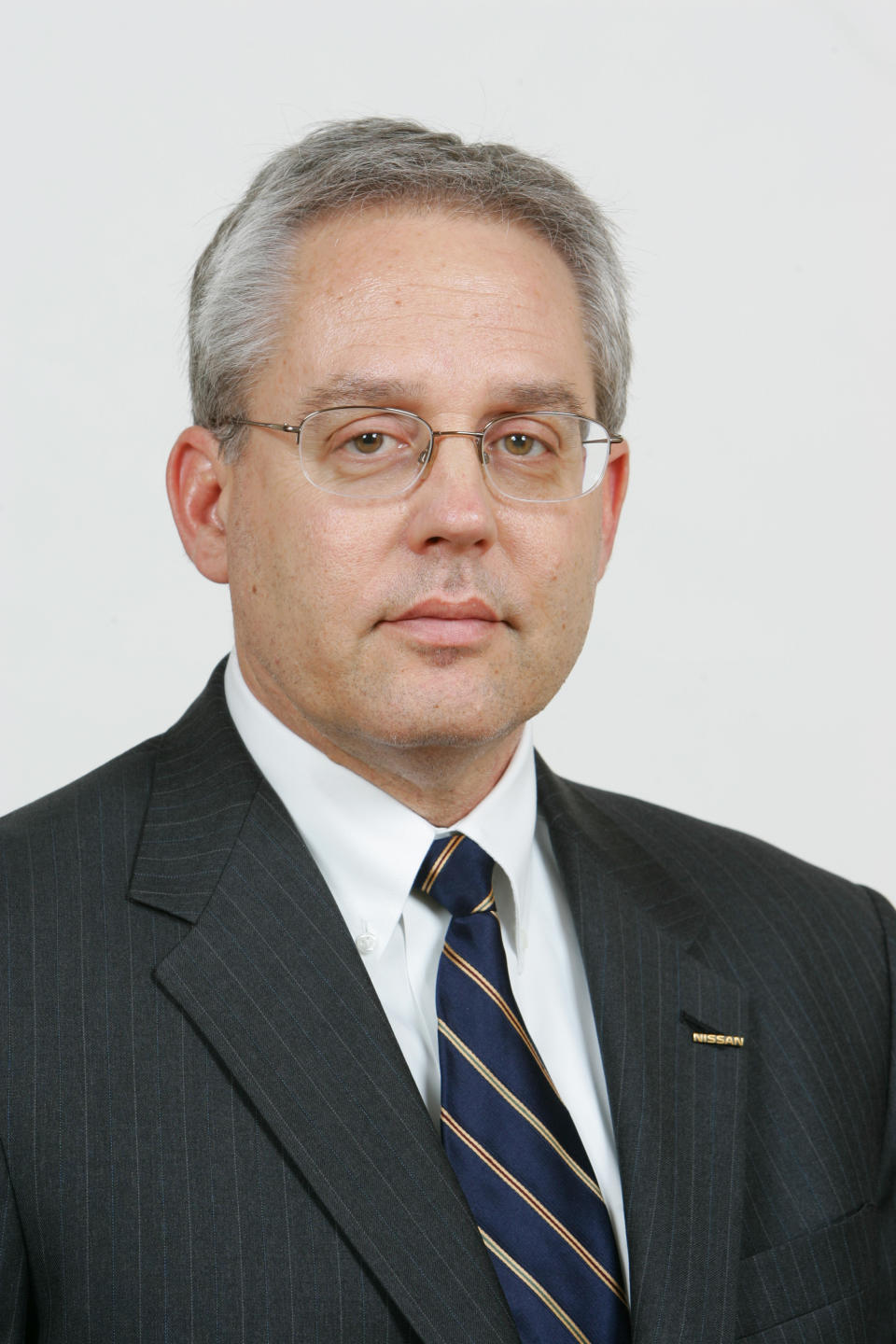 This undated photo released by Nissan Motor Co. shows Nissan executive Greg Kelly. Tokyo prosecutors on Monday, Dec. 10, 2018, charged Nissan's former chairman Carlos Ghosn with underreporting his income, with Kelly and the company, according to Japanese media reports. Kelly, 62, is suspected of having collaborated with Ghosn. Kelly's attorney in the U.S. says he is asserting his innocence. (Nissan Motor Co. via AP)