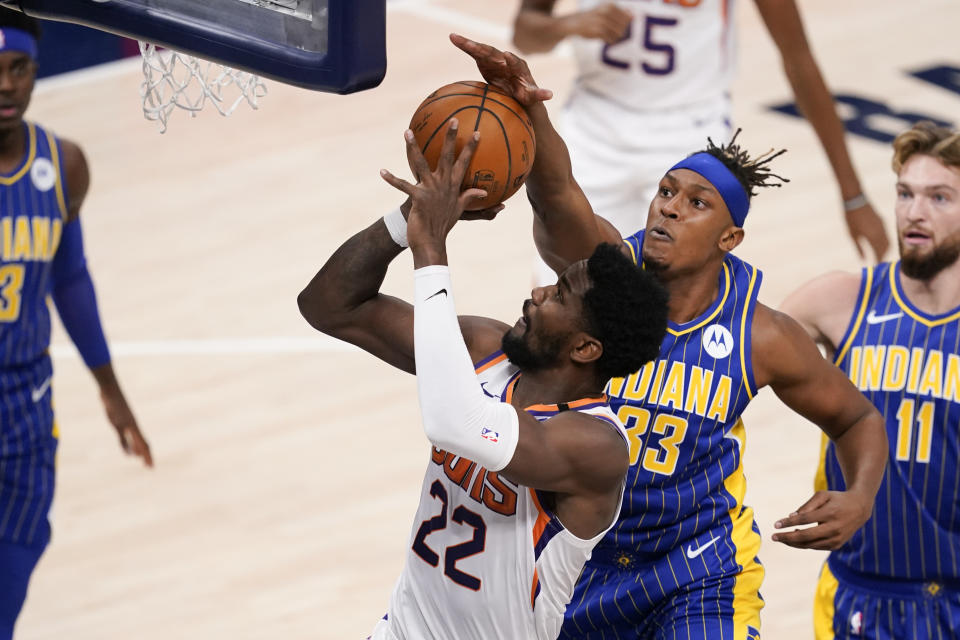 Phoenix Suns' Deandre Ayton (22) shoots against Indiana Pacers' Myles Turner (33) during the first half of an NBA basketball game, Saturday, Jan. 9, 2021, in Indianapolis. (AP Photo/Darron Cummings)