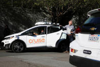 A man gets out of a self-driving Bolt EV car during a media event by Cruise, GM’s autonomous car unit, in San Francisco, California, U.S. November 28, 2017. REUTERS/Elijah Nouvelage