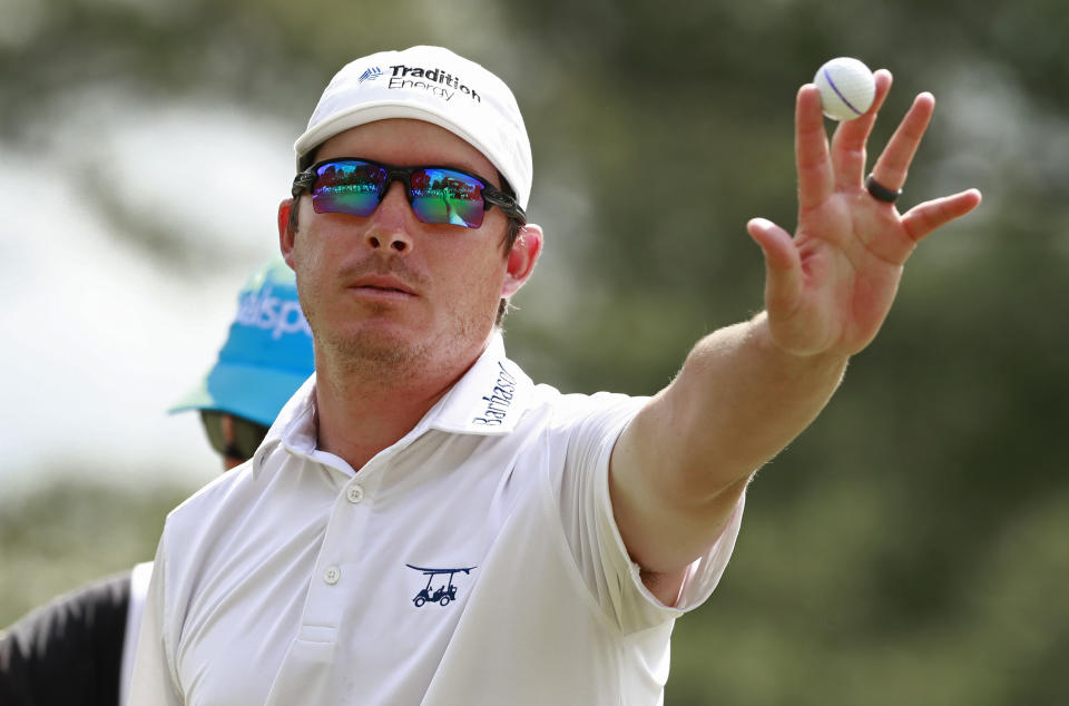 Joel Dahmen holds up the ball after a bogey putt on the ninth hole during the final round of the Wells Fargo Championship golf tournament at Quail Hollow Club in Charlotte, N.C., Sunday, May 5, 2019. (AP Photo/Jason E. Miczek)