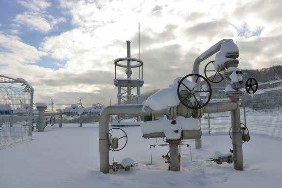 Pipeline valves covered in snow.