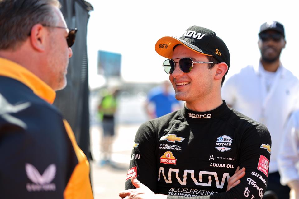 Arrow McLaren SP IndyCar driver Pato O'Ward talks with McLaren Racing CEO Zak Brown at the series' 2022 season-opener in St. Pete.