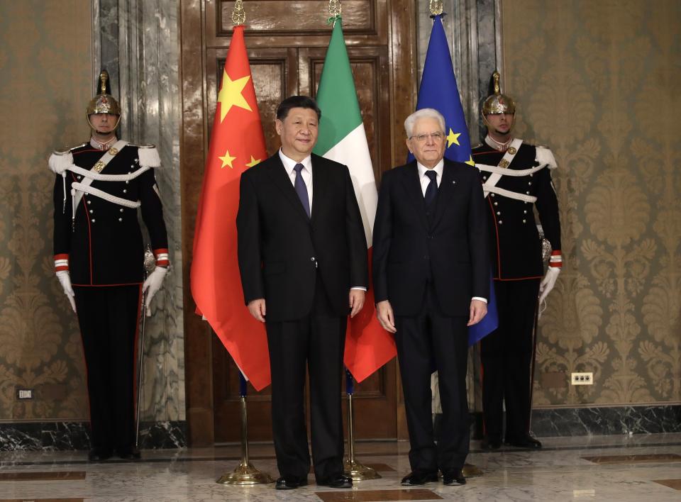 FILE - Chinese President Xi Jinping, left, stands with Italian President Sergio Mattarella for a photo opportunity at the Quirinale Presidential Palace in Rome, on March 22, 2019. A total of 152 countries have signed a BRI agreement with China, though Italy, the only western European country to do so, is expected to drop out when it comes time to renew in March of next year. (AP Photo/Alessandra Tarantino, Pool, File)