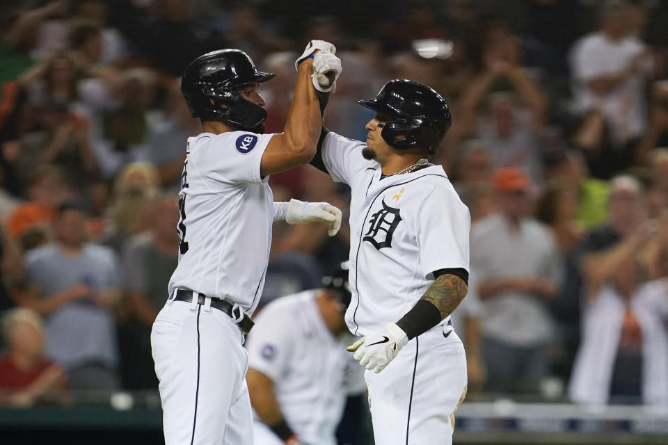 Detroit Tigers shortstop Javier Baez, right, celebrates his two-run home run with Riley Greene in the fifth inning of a baseball game against the Kansas City Royals in Detroit, Friday, Sept. 2, 2022. (AP Photo/Paul Sancya)