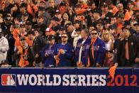 SAN FRANCISCO, CA - OCTOBER 24: Fans stand and cheer behind a World Series sign as the San Francisco Giants host the Detroit Tigers during Game One of the Major League Baseball World Series at AT&T Park on October 24, 2012 in San Francisco, California. (Photo by Doug Pensinger/Getty Images)