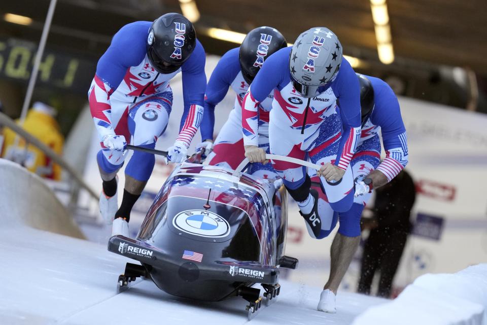 Hunter Church of the United States and his team start during the men's four-man bobsleigh World Cup race in Igls, near Innsbruck, Austria, Sunday, Nov. 21, 2021. (AP Photo/Matthias Schrader)