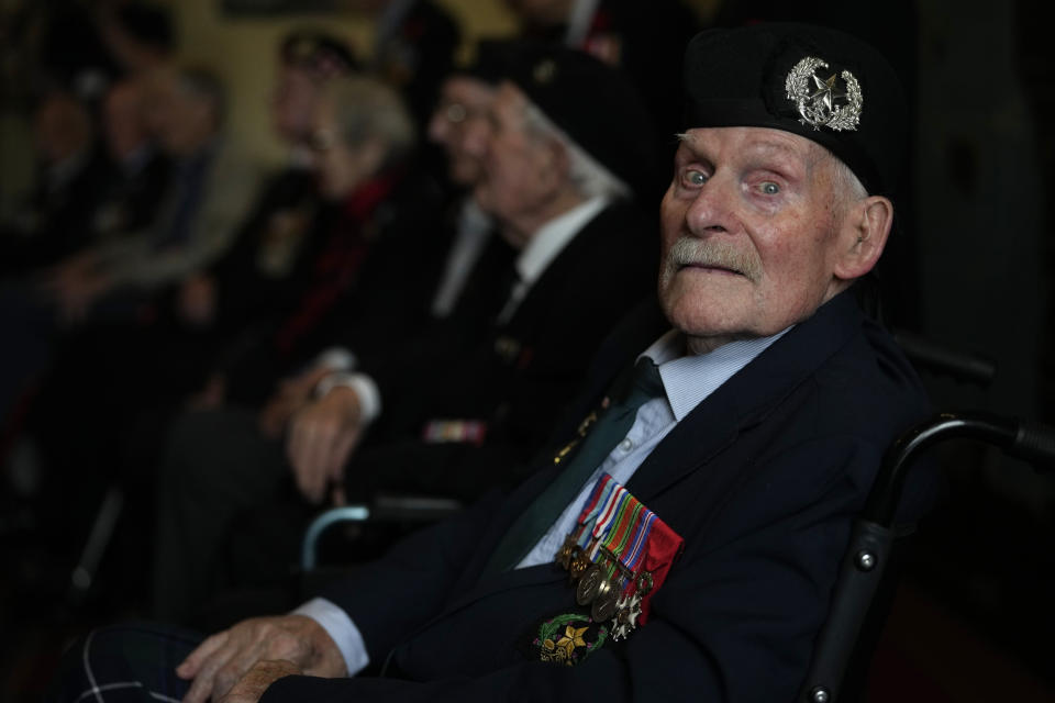 British Normandy veteran Donald Turrell, of the Cameron Highlanders, poses for a portrait in the 'Map Room' which shows the large diagram of the D-Day Invasion, at Southwick army base near Portsmouth, England, Monday, June 3, 2024. Turrell is part of a group of veterans travelling to France for the 80th anniversary commemoration of the D-Day Invasion. (AP Photo/Alastair Grant)