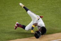 Atlanta Braves' Ronald Acuna Jr. falls at first base during the sixth inning in Game 4 of a baseball National League Championship Series against the Los Angeles Dodgers Thursday, Oct. 15, 2020, in Arlington, Texas. (AP Photo/Sue Ogrocki)