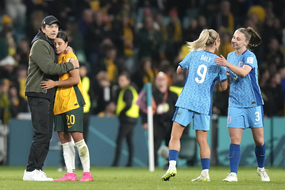 Australia's head coach Tony Gustavsson and Australia's Sam Kerr react to their loss at the end of the Women's World Cup semifinal soccer match between Australia and England at Stadium Australia in Sydney, Australia, Wednesday, Aug. 16, 2023. (AP Photo/Alessandra Tarantino)