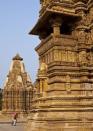 Visitors are dwarfed by the enormity of the temples in Khajuraho.