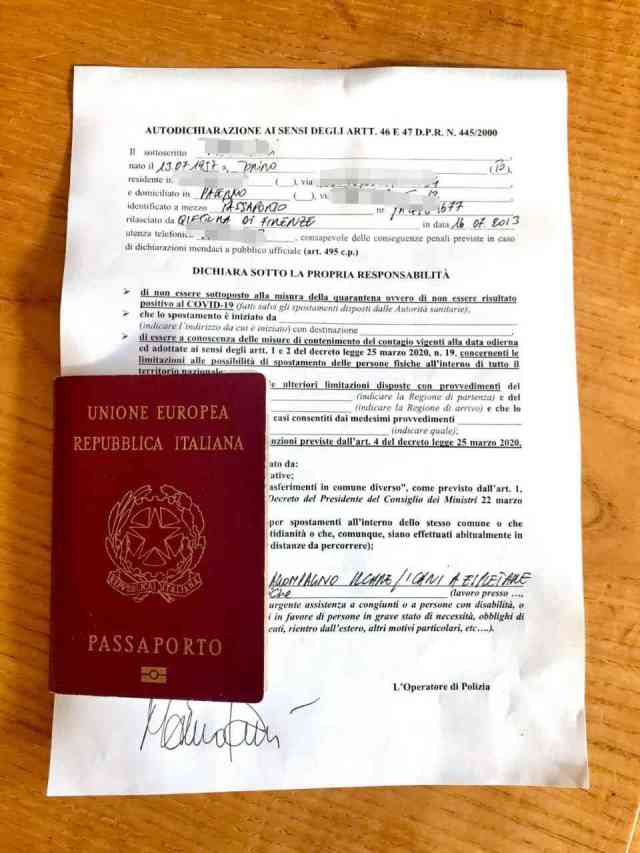 An image of a pass that allows Italians to move about, depending on need. The passport along with the pass is this person's identity document.