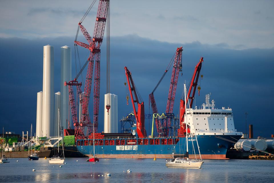 A ship carrying parts for the Vineyard Wind offshore wind turbines is seen at the New Bedford Marine Commerce Terminal in New Bedford