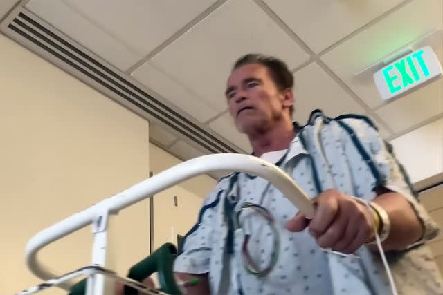 <p>The Pump/YouTube</p> Arnold Schwarzenegger using a walker in the hospital after open heart surgery