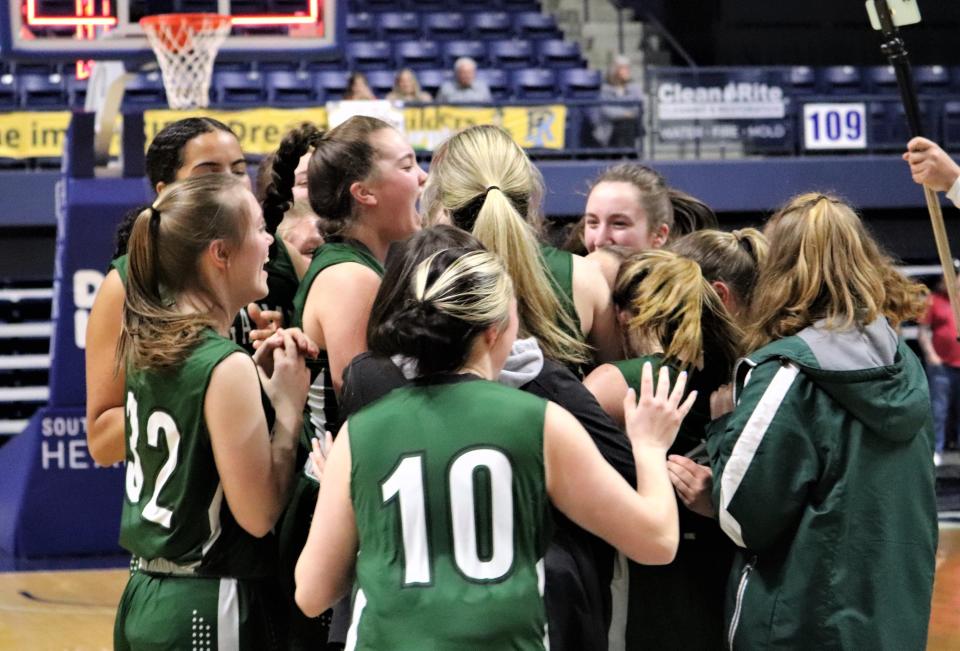 Members of the Ponaganset girls basketball team celebrate their state title after defeating Juanita Sanchez, 58-51, on Sunday at the Ryan Center.