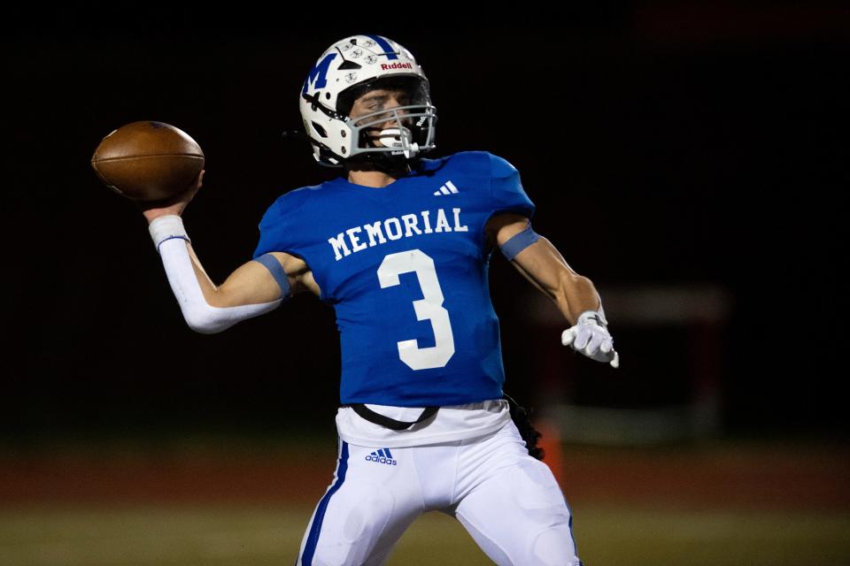 Memorial’s Luke Ellspermann (3) passes as the East Central Trojans play the Memorial Tigers during the 2023 IHSAA 4A Regional at Enlow Field in Evansville, Ind., Friday, Nov. 10, 2023.