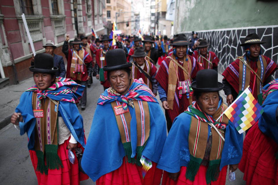 Supporters of former President Evo Morales march in La Paz, Bolivia, Thursday, Nov. 14, 2019. Morales resigned and flew to Mexico under military pressure following massive nationwide protests over alleged fraud in an election last month in which he claimed to have won a fourth term in office. (AP Photo/Natacha Pisarenko)