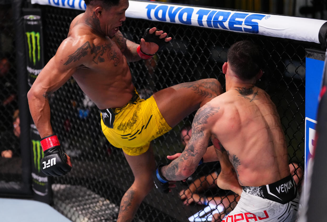 LAS VEGAS, NEVADA - MARCH 02: (L-R) Vinicius Oliveira of Brazil lands a flying knee against Benardo Sopaj of Albania in a bantamweight bout during the UFC Fight Night event at UFC APEX on March 02, 2024 in Las Vegas, Nevada. (Photo by Jeff Bottari/Zuffa LLC via Getty Images)