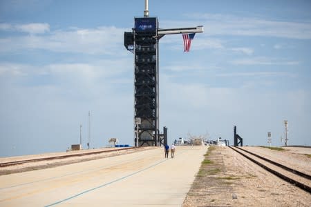 Astronaut Michael Collins walks with NASA's John F. Kennedy Space Center Director Bob Cabana at Launch Pad 39A at the NASA's John F. Kennedy Space Center on the 50th anniversary of the launch of the Apollo 11 mission to the moon, in Cape Canaveral