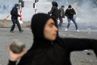 <p>Activists clash with riot police during the traditional May Day rally in the center of Paris, France, May 1, 2018. Each year, people around the world take to the streets to mark International Workers’ Day, or May Day. (Photo: Francois Mori/AP) </p>