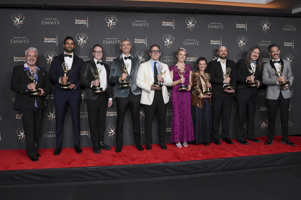 The team from "Weird: The Al Yankovic Story" pose in the press room with the award for outstanding television movie during night one of the Creative Arts Emmy Awards on Saturday, Jan. 6, 2024, at the Peacock Theater in Los Angeles. (Photo by Richard Shotwell/Invision/AP)