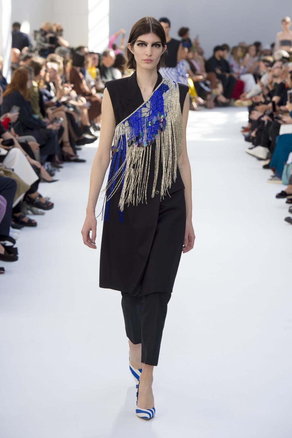 Dries Van Noten’s Spring 2019 vest is given a fashion twist with a beaded, fringed sling.