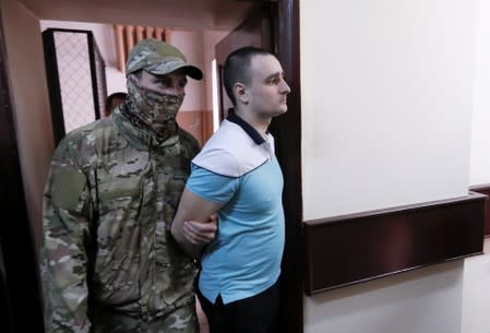 Crew member of Ukrainian naval ships, which were seized by Russia's FSB security service in November 2018, is escorted before a court hearing in Moscow