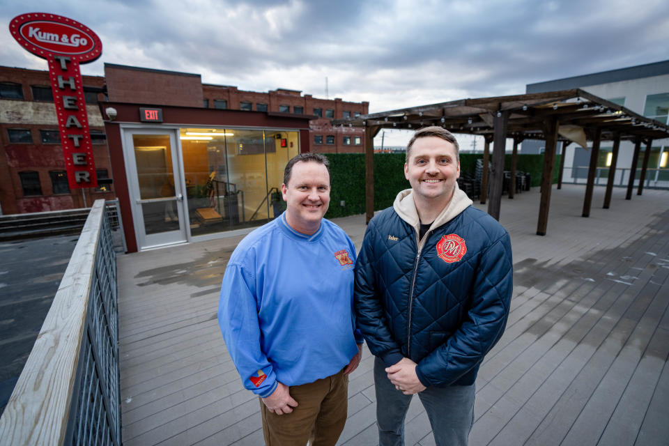 Brian Peppmeier, left, and Russell Baker stand for a photo on the rooftop balcony of The Shop DSM.