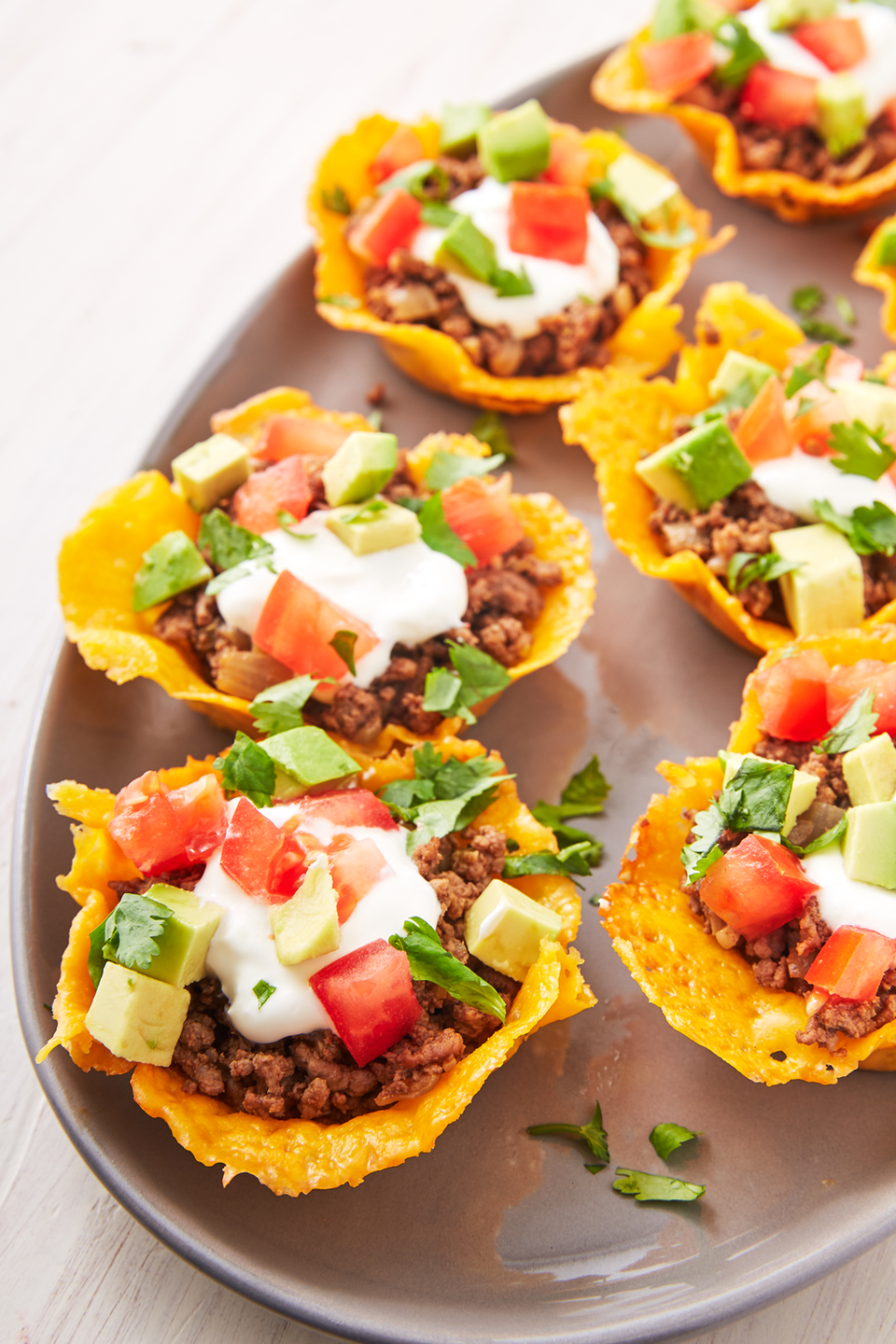 <p>Just like you can make chips out of cheese, taco shells can also be fashioned out of fried cheese. Let your cheese cool in the muffin shell before stuffing them with keto-friendly ingredients.</p><p><a href="https://www.delish.com/cooking/recipe-ideas/a19637783/keto-taco-cups-recipe/" rel="nofollow noopener" target="_blank" data-ylk="slk:Get the recipe from Delish »;elm:context_link;itc:0;sec:content-canvas" class="link "><em>Get the recipe from Delish</em> »</a></p>