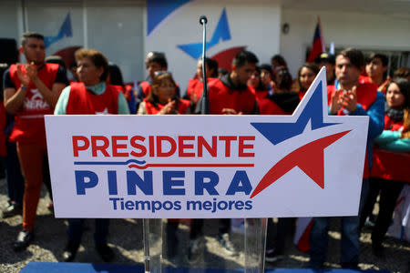The podium of Chilean conservative presidential candidate Sebastian Pinera (not pictured) is seen during a campaign rally in Santiago, Chile September 20, 2017. Picture taken September 20, 2017. The banner reads "Pinera president, better times". REUTERS/Ivan Alvarado