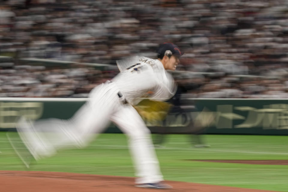 Roki Sasaki of Japan pitches during their Pool B game against the Czech Republic at the World Baseball Classic at the Tokyo Dome, Japan, Saturday, March 11, 2023. (AP Photo/Eugene Hoshiko)