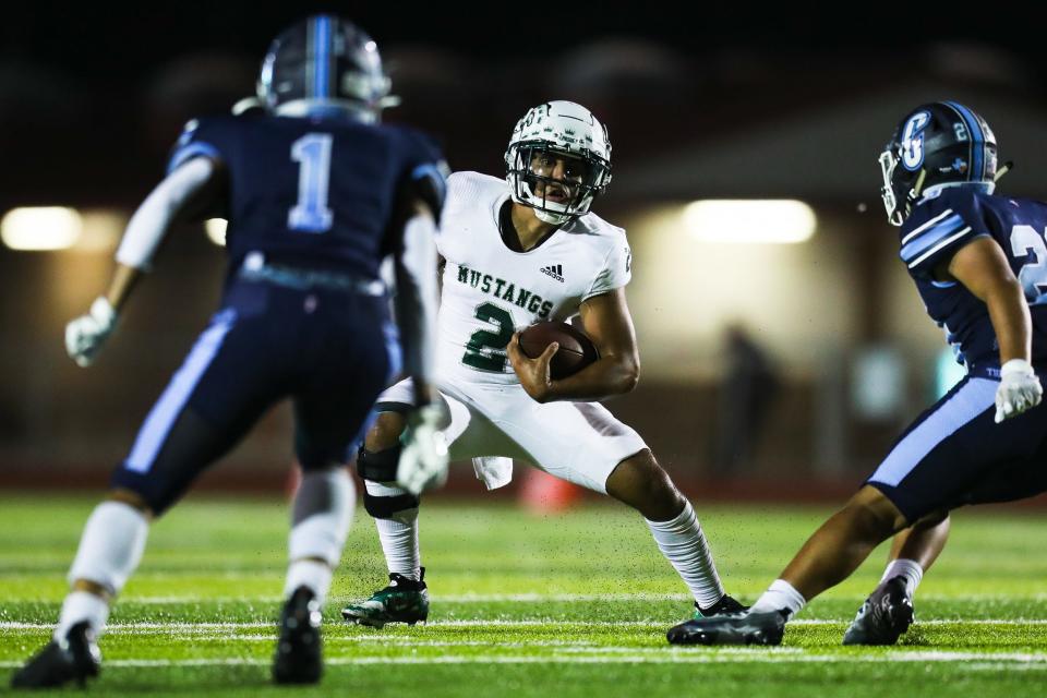 King's Bryan Guillen (2) jukes defenders in a high school football game against Carroll at Cabaniss Athletic Complex in Corpus Christi, Texas on Friday, Sep. 29, 2022.