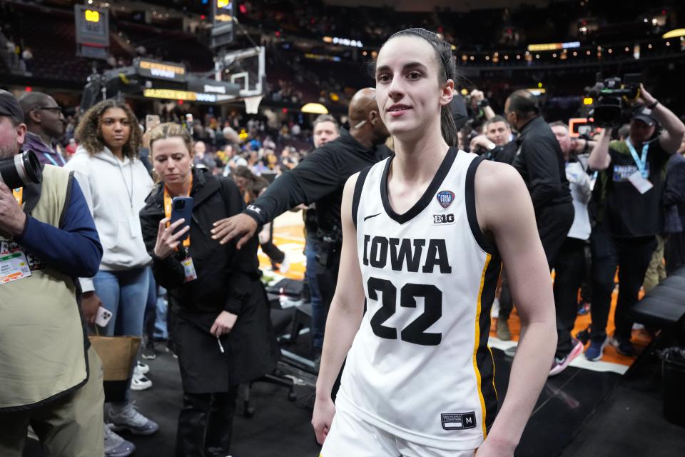 Iowa guard Caitlin Clark (22) leaves the court after the Hawkeyes defeated Connecticut in Friday's national semifinal at Rocket Mortgage FieldHouse.