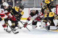 New Jersey Devils' Pavel Zacha (37) scores against Boston Bruins' Tuukka Rask (40) during the third period of an NHL hockey game, Sunday, March 7, 2021, in Boston. (AP Photo/Michael Dwyer)