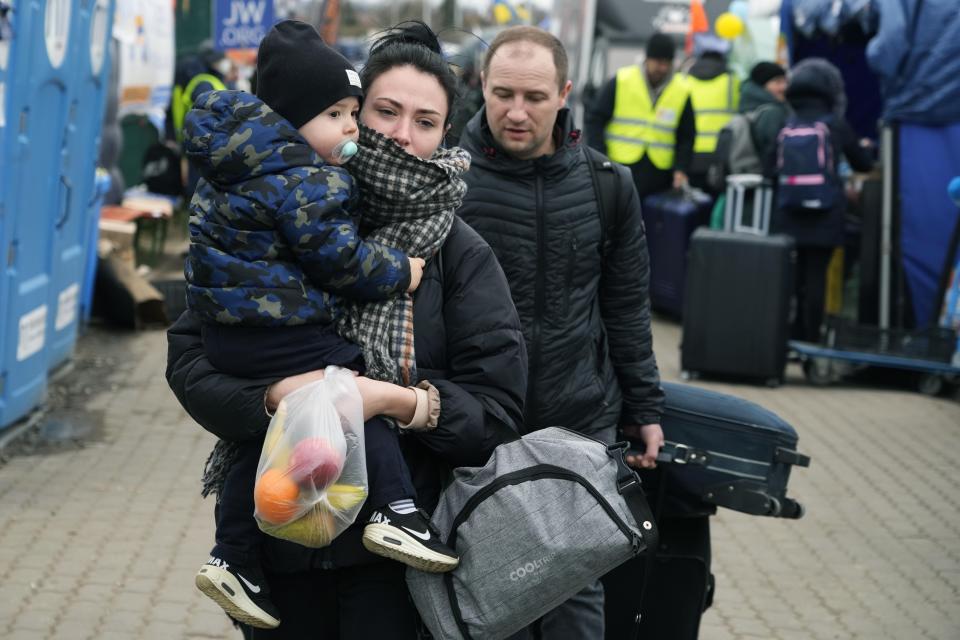 People return back to Ukraine, at the border crossing in Medyka, southeastern Poland, Wednesday, April 6, 2022. The reason for their return is not known. (AP Photo/Sergei Grits)