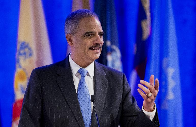 Attorney General Eric Holder speaks at the annual Attorneys General Winter Meeting in Washington, Tuesday, Feb. 25, 2014. Holder said state attorneys general are not obligated to defend laws in their states banning same sex-marriage if they don't believe in them. (AP Photo/Manuel Balce Ceneta)