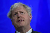 Britain's Prime Minister Boris Johnson reacts during a news conference at 10 Downing Street, amid the coronavirus disease outbreak, in London, Tuesday April 20, 2021. (Toby Melville/Pool via AP)